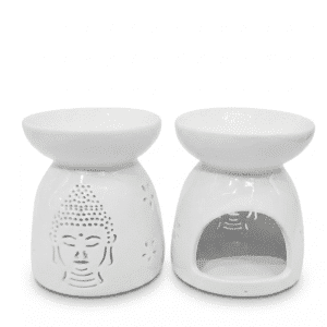 Dos hornillos de cerámica blanca de 9,5 cm con diseño calado de cabeza de Buda en el frente y flores en los laterales sobre fondo blanco.