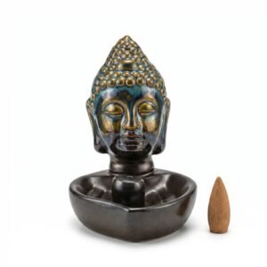 Quemador de incienso tipo cascada de humo con forma de cabeza de Buda en cerámica esmaltada oscura con detalles azules y dorados, incluye cono de incienso.